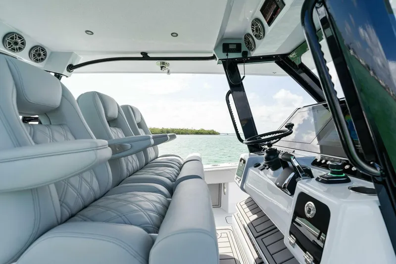 Slide: The Image of 2023 Barker Boatworks 40 High Performance Cat interior with luxurious seating and advanced controls. - 28