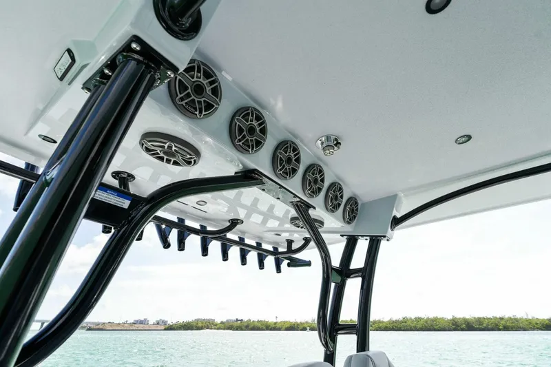 Slide: The Image of 2023 Barker Boatworks 40 High Performance Cat interior with speakers and rod holders. - 30
