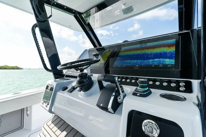 Slide: The Image of 2023 Barker Boatworks 40 High Performance Cat cockpit with advanced navigation system. - 31