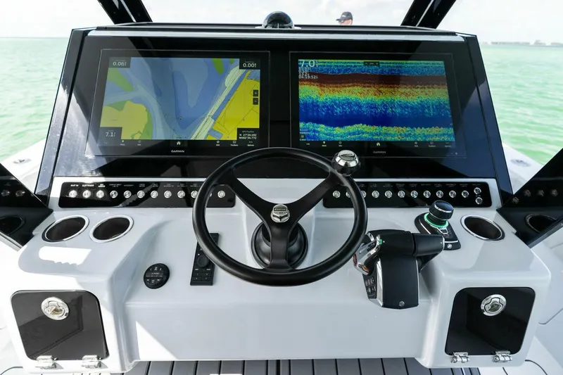 Slide: The Image of 2023 Barker Boatworks 40 High Performance Cat cockpit with advanced navigation displays. - 32