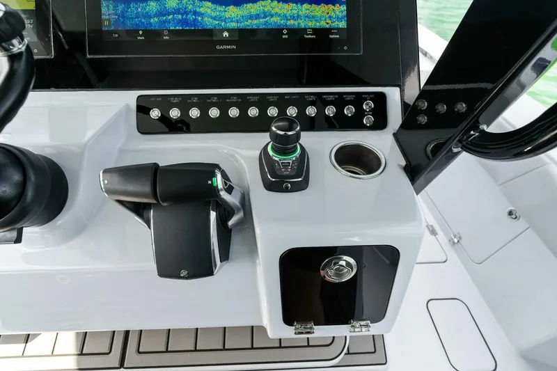 Slide: The Image of 2023 Barker Boatworks 40 High Performance Cat cockpit controls and navigation display. - 33