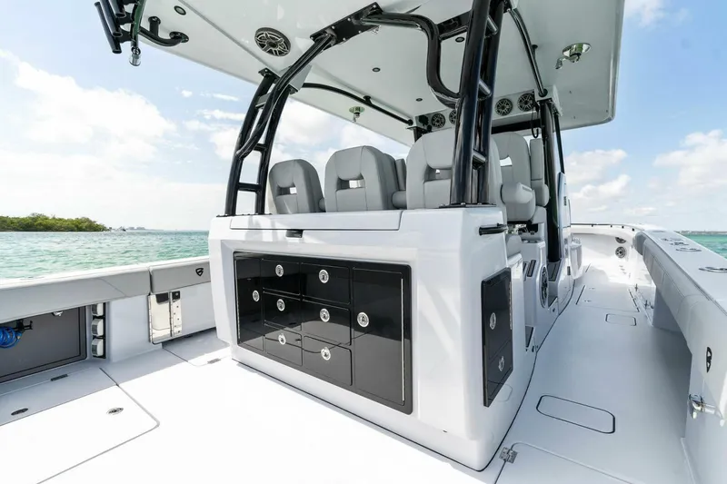 Slide: The Image of 2023 Barker Boatworks 40 High Performance Cat interior with sleek seating and storage. - 35