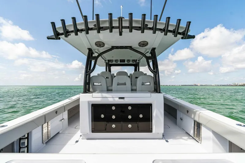 Slide: The Image of 2023 Barker Boatworks 40 High Performance Cat on open water, showcasing spacious deck and seating. - 36