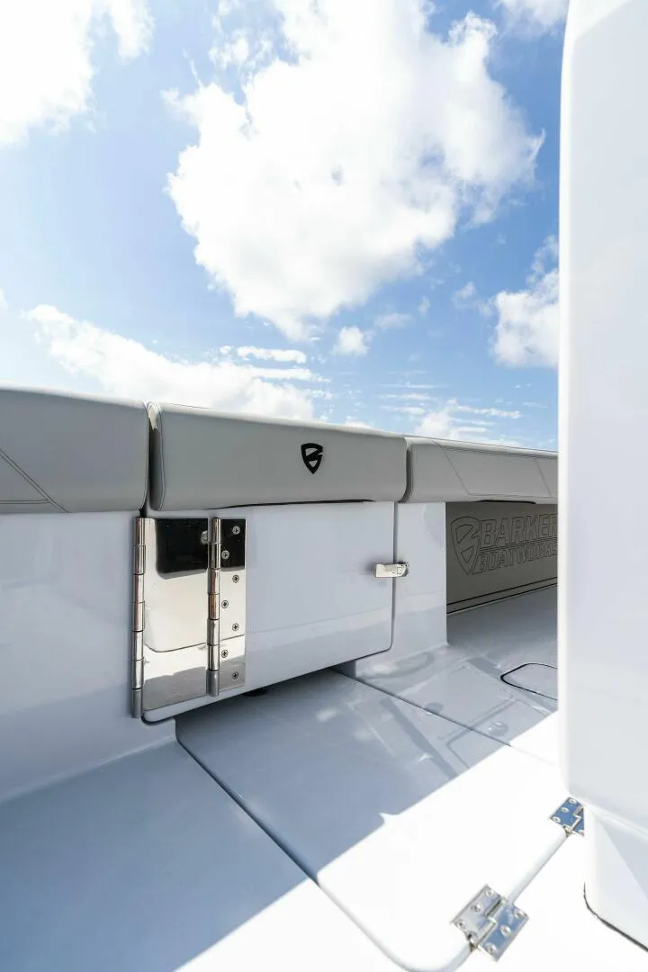 Slide: The Image of 2023 Barker Boatworks 40 High Performance Cat, sleek deck design under blue sky. - 41