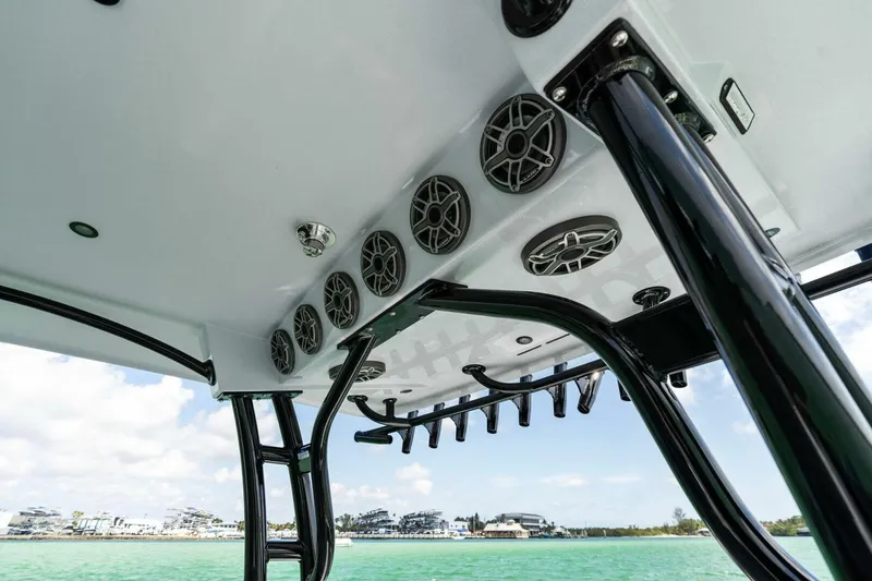 Slide: The Image of 2023 Barker Boatworks 40 High Performance Cat with sleek audio system and rod holders. - 42