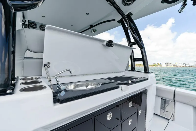 Slide: The Image of 2023 Barker Boatworks 40 High Performance Cat, sleek onboard kitchen with sink and storage. - 43
