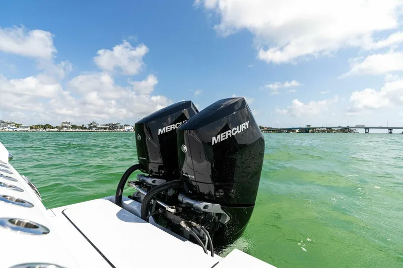 Slide: The Image of 2023 Barker Boatworks 40 High Performance Cat with twin Mercury engines on water. - 45