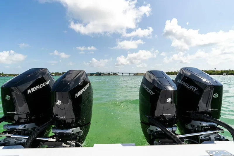 Slide: The Image of 2023 Barker Boatworks 40 High Performance Cat with four Mercury outboard engines on water. - 46