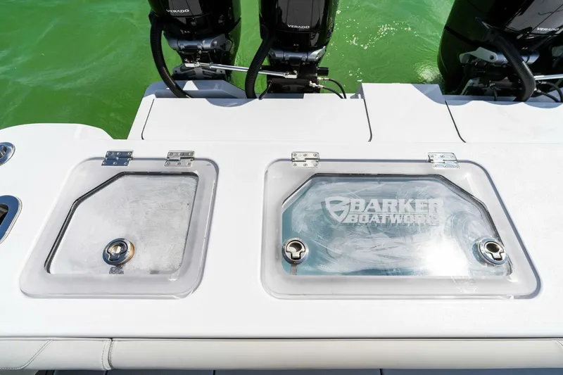 Slide: The Image of 2023 Barker Boatworks 40 High Performance Cat with dual outboard engines and storage compartments. - 47