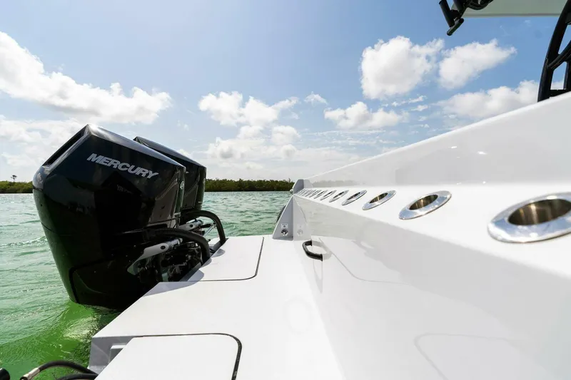 Slide: The Image of 2023 Barker Boatworks 40 High Performance Cat with Mercury engine on water. - 48