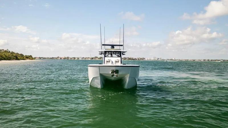 Slide: The Image of 2023 Barker Boatworks 40 High Performance Cat on open water, front view. - 49