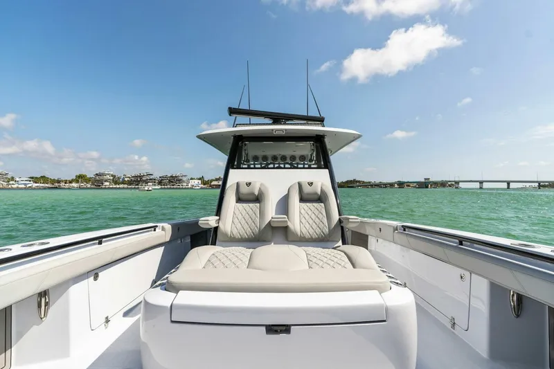 Slide: The Image of 2023 Barker Boatworks 40 High Performance Cat on turquoise water, clear sky. - 7