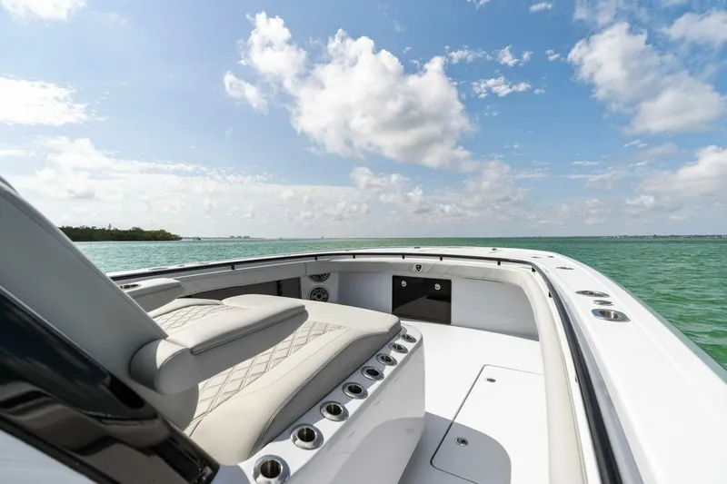 Slide: The Image of 2023 Barker Boatworks 40 High Performance Cat on open water under blue sky. - 8