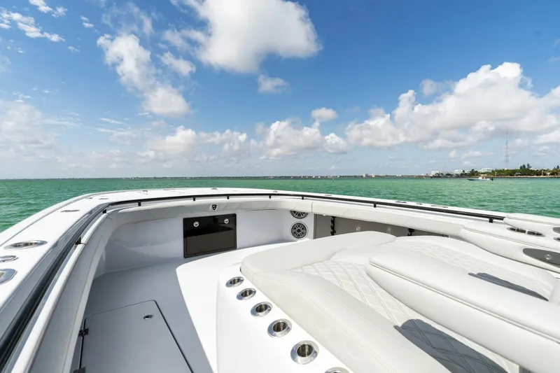 Slide: The Image of 2023 Barker Boatworks 40 High Performance Cat on open water, clear sky. - 9