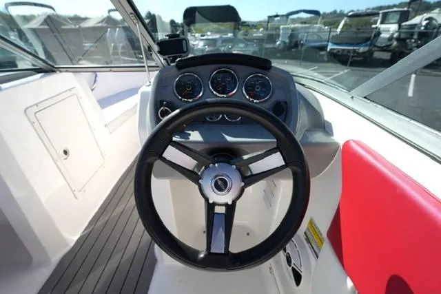Slide: The Image of 2016 Chaparral H20 19 boat dashboard with steering wheel and gauges. - 10