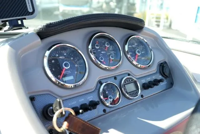 Slide: The Image of Dashboard of 2016 Chaparral H20 19 boat with gauges and controls. - 11