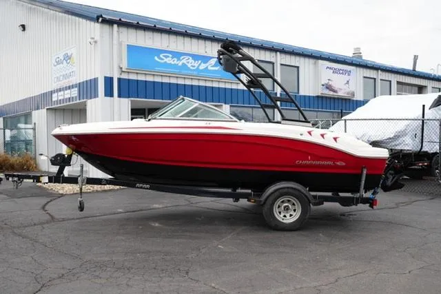Slide: The Image of 2016 Chaparral H20 19 boat in red, parked outside a dealership. - 14