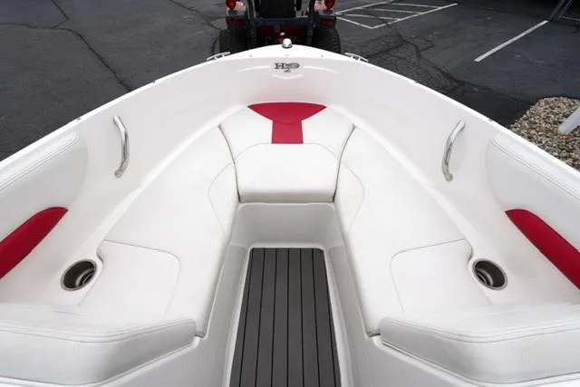Slide: The Image of 2016 Chaparral H20 19 boat interior with white and red seating. - 23