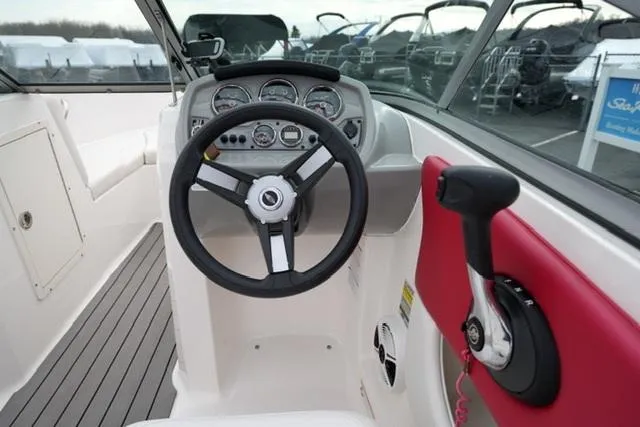 Slide: The Image of 2016 Chaparral H20 19 boat cockpit with steering wheel and control panel. - 28