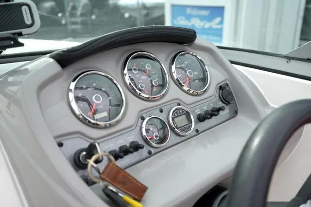 Slide: The Image of Dashboard of a 2016 Chaparral H20 19 boat with gauges and controls. - 29