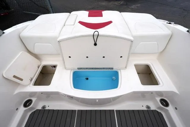 Slide: The Image of 2016 Chaparral H20 19 boat interior with storage compartments and seating. - 31