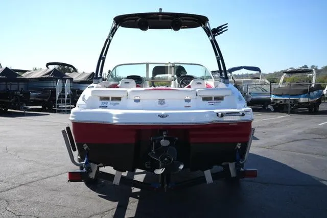Slide: The Image of 2016 Chaparral H20 19 boat, rear view, parked on trailer in marina. - 5