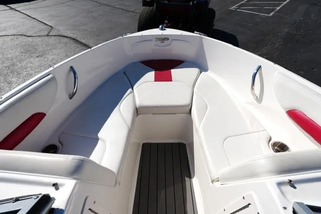 Slide: The Image of 2016 Chaparral H20 19 boat interior with white and red seating. - 8