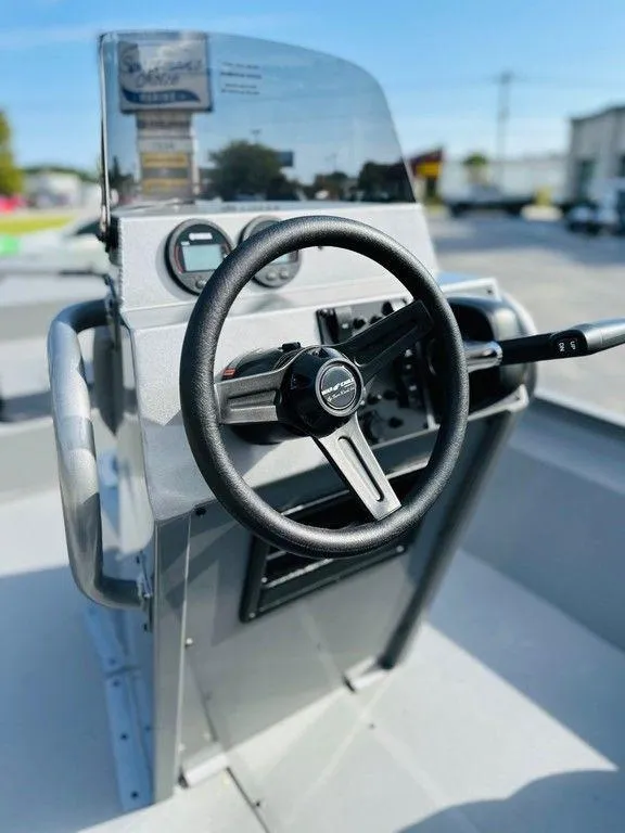 Slide: The Image of 2025 War Eagle Blackhawk 961 boat console with steering wheel and controls. - 3