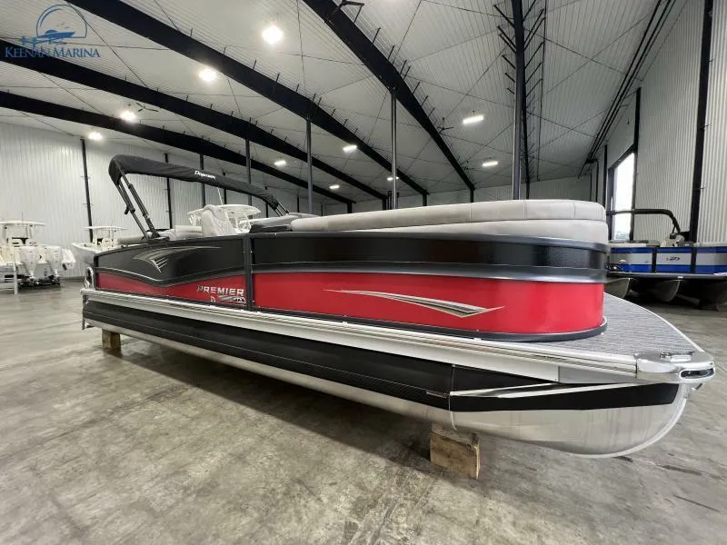 The Image of 2023 Premier 250 Intrigue RF pontoon boat in a spacious indoor showroom. - 1
