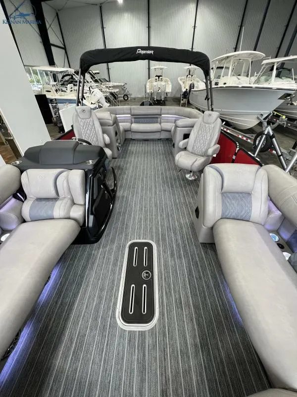 Slide: The Image of 2023 Premier 250 Intrigue RF pontoon boat interior with luxurious seating and modern design. - 11