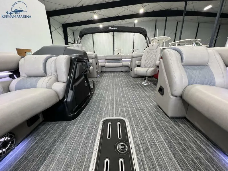Slide: The Image of 2023 Premier 250 Intrigue RF pontoon boat interior with luxurious seating and modern design. - 16
