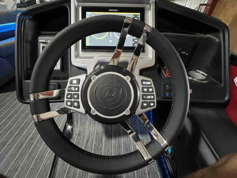 Slide: The Image of Steering wheel of 2023 Premier 250 Intrigue RF boat with digital display. - 21