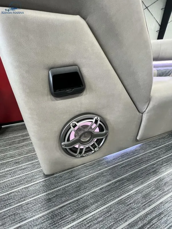 Slide: The Image of 2023 Premier 250 Intrigue RF boat interior with speaker and cup holder. - 22