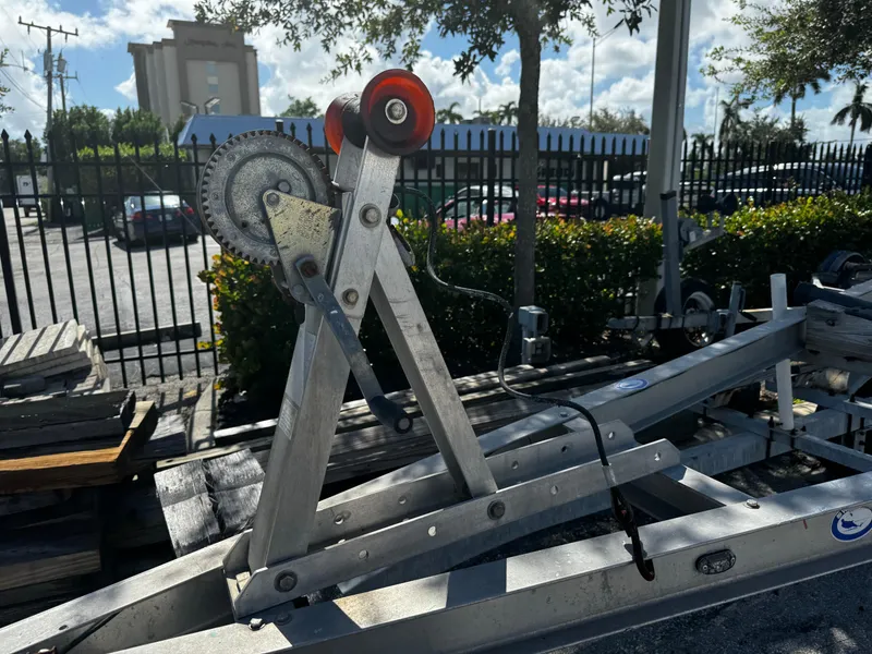 Slide: The Image of Boat Master trailer winch system, 2020 model, in a parking lot setting. - 2