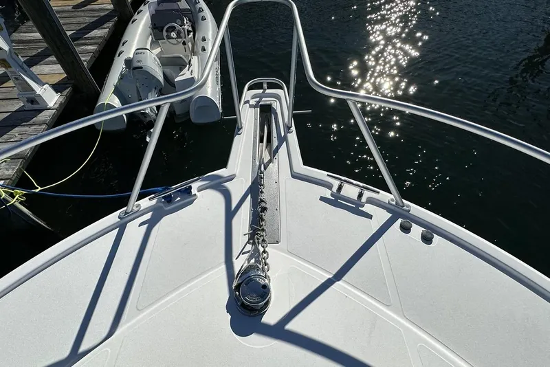 Slide: The Image of Bow view of 2008 Cabo 40 boat with sparkling water reflections. - 17