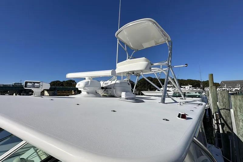 Slide: The Image of 2008 Cabo 40 boat with radar and tower against clear blue sky. - 19
