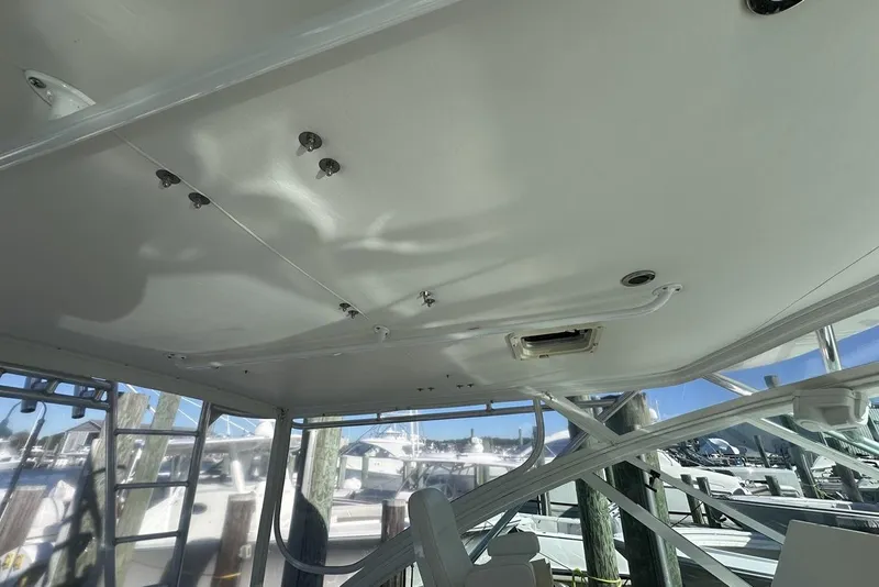 Slide: The Image of 2008 Cabo 40 boat interior with white ceiling and marina view. - 33