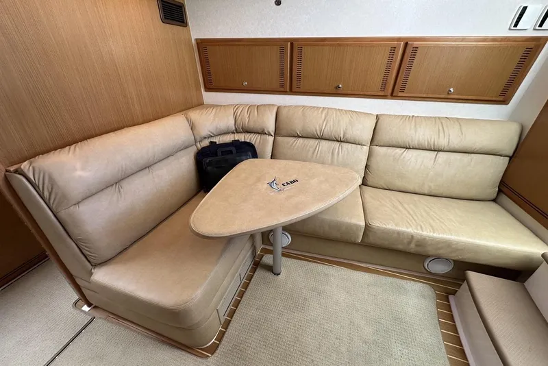 Slide: The Image of Luxurious interior of 2008 Cabo 40 yacht with beige leather seating and wooden accents. - 37