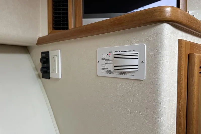 Slide: The Image of 2008 Cabo 40 interior with carbon monoxide alarm and electrical outlet. - 53