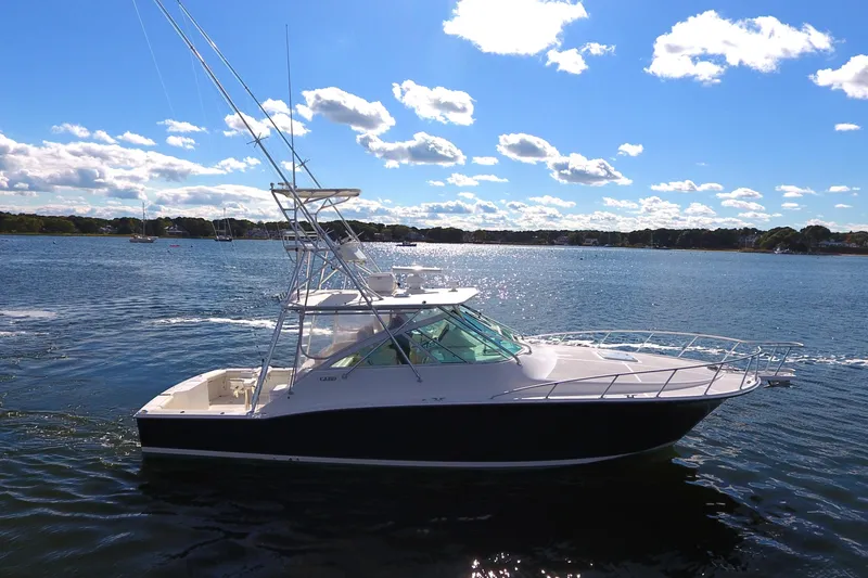 Slide: The Image of 2008 Cabo 40 yacht on a sunny day, cruising on calm waters. - 6