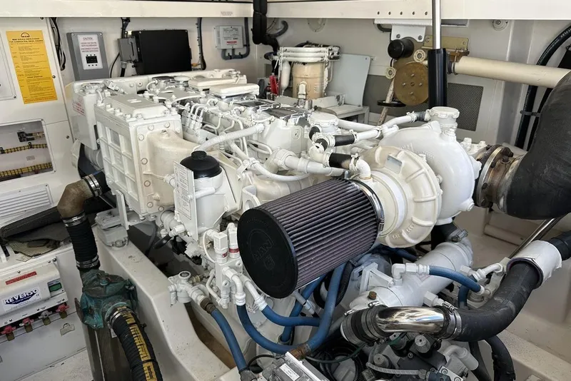 Slide: The Image of Engine room of a 2008 Cabo 40 boat, showcasing detailed mechanical components. - 65