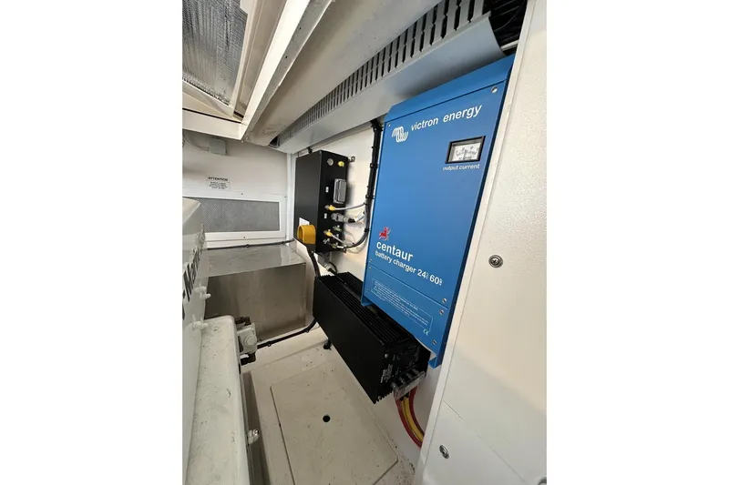 Slide: The Image of 2008 Cabo 40 engine room with Victron Energy Centaur battery charger. - 67