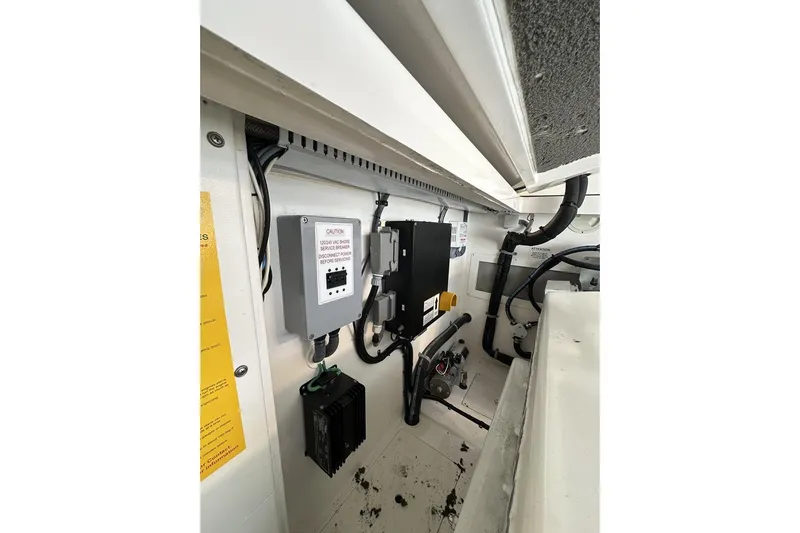 Slide: The Image of Electrical panel and wiring inside a 2008 Cabo 40 boat engine compartment. - 68