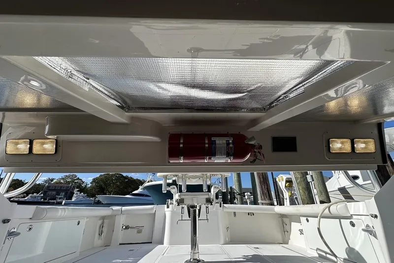 Slide: The Image of 2008 Cabo 40 boat interior with fire extinguisher and lighting fixtures. - 73