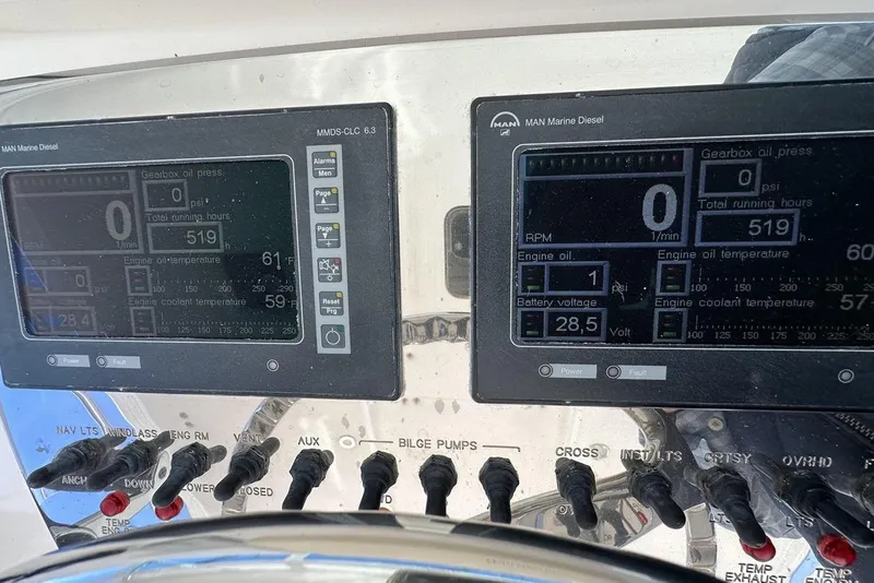 Slide: The Image of Control panel of a 2008 Cabo 40 boat with engine diagnostics display. - 77