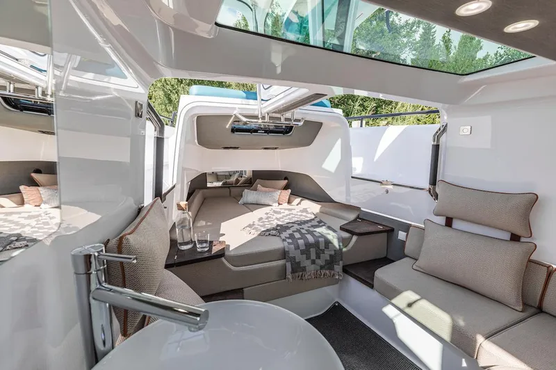 Slide: The Image of Luxurious interior of 2023 Axopar 37 XC Cross Cabin with wet bar and seating. - 20