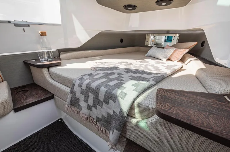 Slide: The Image of Luxurious cabin interior of 2023 Axopar 37 XC Cross Cabin with cozy bed and modern decor. - 21