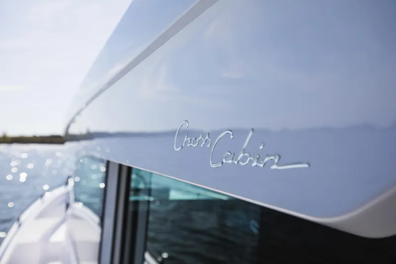 Slide: The Image of 2023 Axopar 37 XC Cross Cabin Wet Bar on water, sleek design detail. - 28