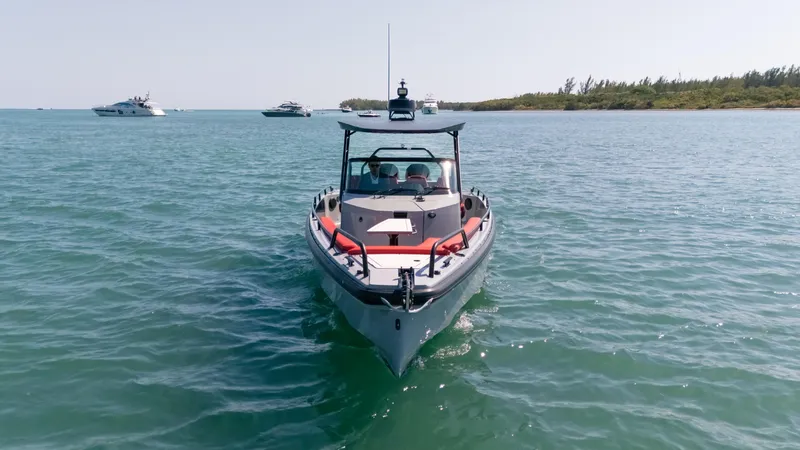 Slide: The Image of 2023 BRABUS Shadow 500 T-Top boat cruising on open water. - 12