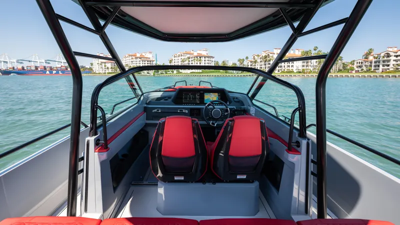 Slide: The Image of 2023 BRABUS Shadow 500 T-Top boat interior with red seats and modern dashboard. - 14